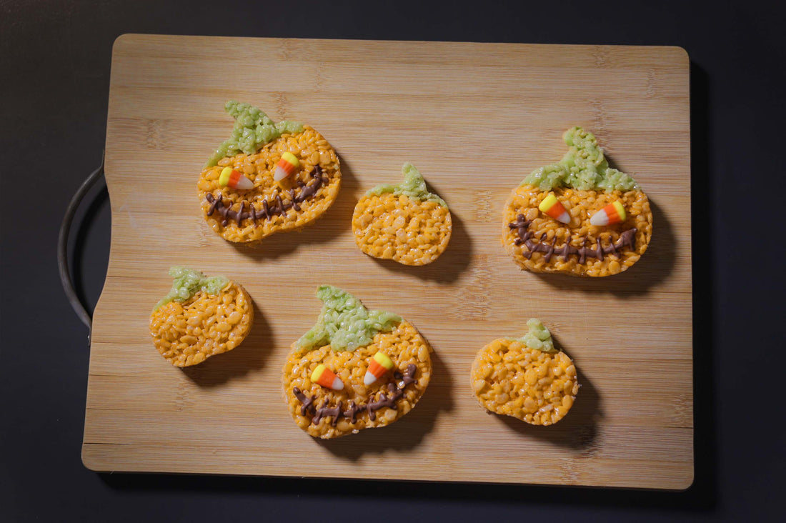 Infused Jack o Lantern Rice Krispie Treats with Chocolate Mouths and Candy Corn Eyes